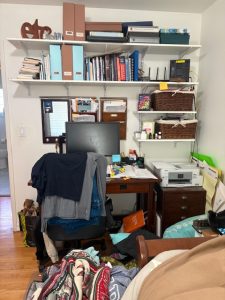 Home office desk with clutter