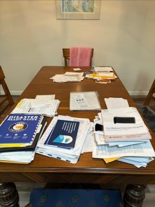 Dining table-papers on it